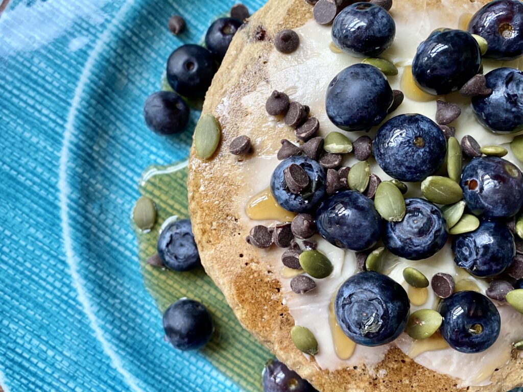 blue plate filled with oatmeal pancakes 