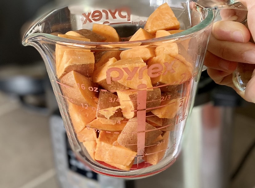 pyrex measuring cup with sweet potatoes